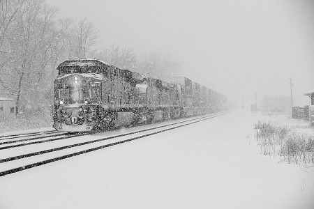 Following Amtrak was the Q020, an eastbound CSX stack train. It was moving rather slowly, but soon picked up speed. One of the attractions of photographing trains in snow is getting images in which snow is plastered all over the lead unit’s nose. 