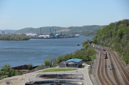 An eastbound container train approaches. That is Neville Island in the distance in the river.