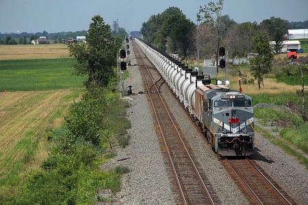 The 65R is about to clear the crossovers west of Butler. Once it does, the CP manifest freight in the distance will crossover from Track 2 to Track 1.