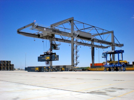 A wide-span crane shuffles containers at the CSX North Baltimore intermodal hub in June 2011. (Photograph by Craig Sanders)