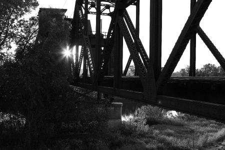 As the sun sets, this former Rock Island bridge still stands, although with no tracks, a silent sentinel to a bygone era when multiple railroads called on Kansas City.
