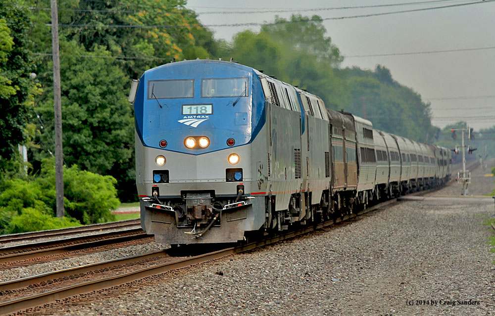 Running more than 10 hours late, Amtrak's westbound Lake Shore Limited rushes through Olmsted Falls just before 2:30 p.m. on Sunday.