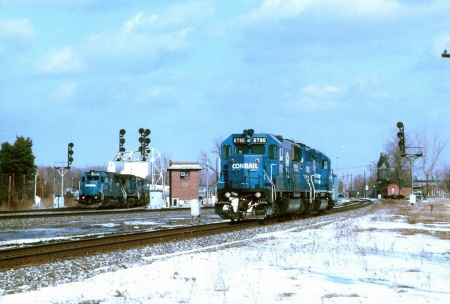 Conrail power everywhere! SD50 No. CR 6798 leads a westbound by BE tower on Track 1, while SD50 No. 6790 leads a light power move on the former Big Four. 