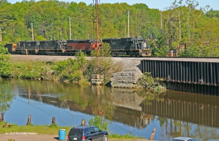 En route to the upper yard, I get a glimpse for the first time of a train on the lead over Conneaut Creek. The water was calm enough to make a reflection.