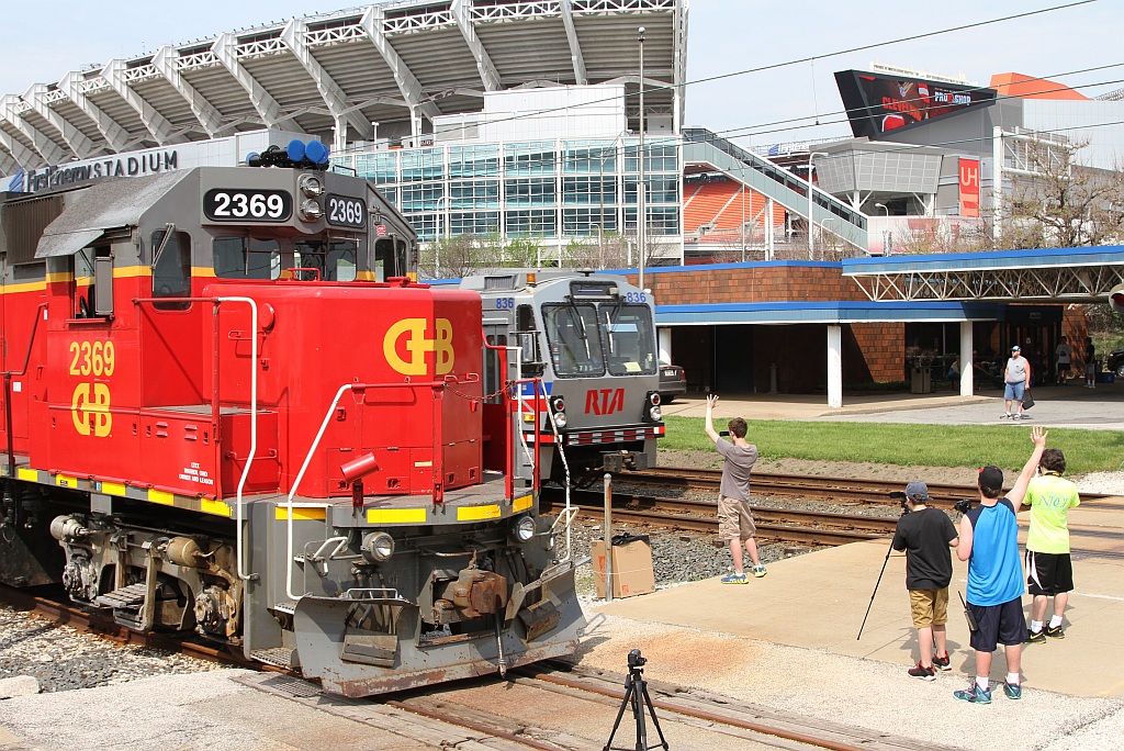 Some railfans record the passage of an RTA Waterfront train.