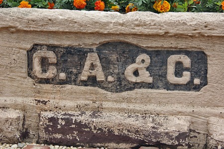 "C.A.&C." inscription on a monument dedicated on July 4, 1897