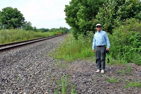 Peter Bowler stands at the site of the Atlantic passenger station of the Erie Railroad. His grandfather went to work here in the 19th century as a telegraph operator.