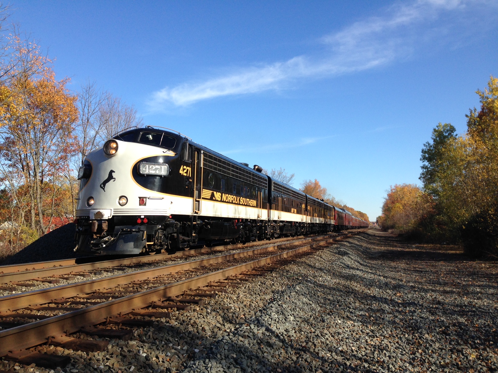 Norfolk Southern's office car special passes some fall foliage in Ravenna on Monday afternoon.