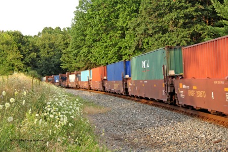 Colorful containers on a late day eastbound intermodal train.
