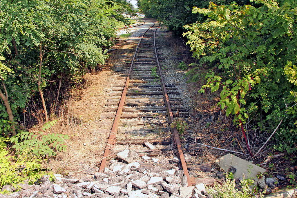 A short stretch of the former B&O remains in place for the W&LE to serve a grain elevator. But this segment of the B&O is used only as a tail track that ends at a pile of ballast north of where the B&O and W&LE used to cross on a diamond.